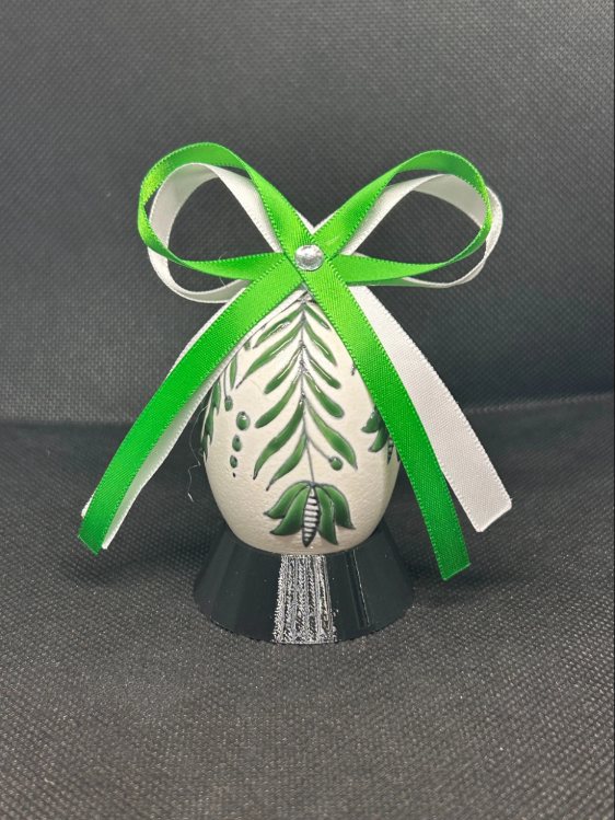 Christmas Emerald pysanka, floral design — white egg with emerald leaves