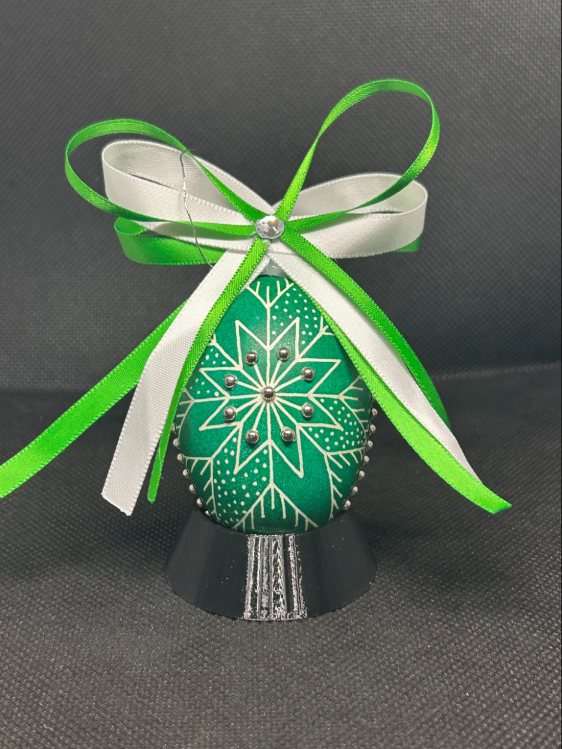 Christmas Emerald pysanka, star design — emerald egg with a white eight-point star