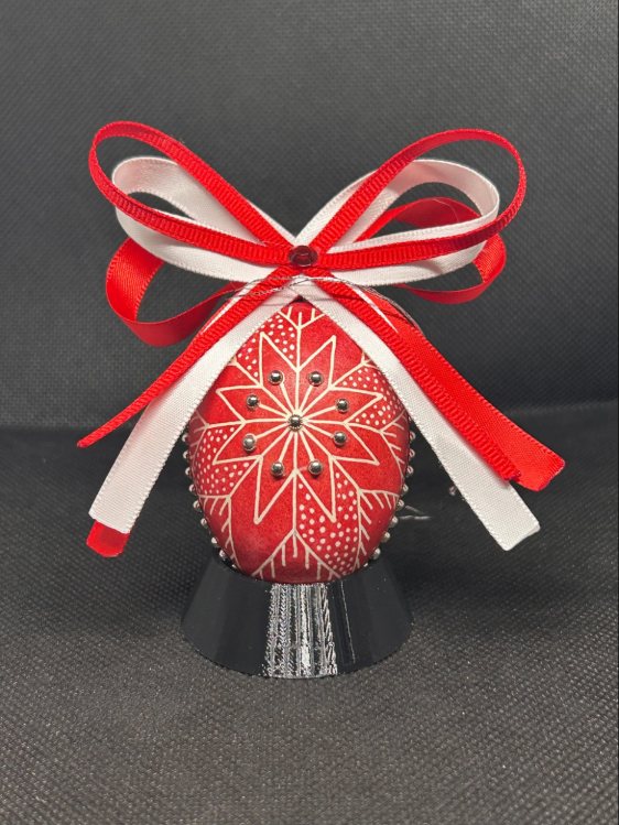 Christmas Ruby pysanka, star design — ruby egg with a white eight-point star