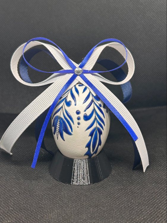 Christmas Sapphire pysanka, floral design — white egg with sapphire leaves
